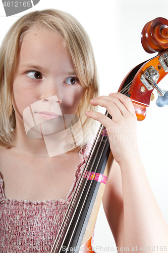 Image of Portrait of a young teenager girl in studio with a cello