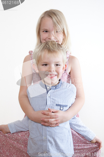 Image of Portrait of a brother and sister in studio