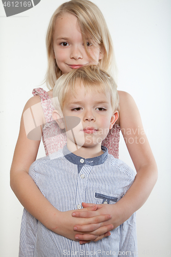 Image of Portrait of a brother and sister in studio