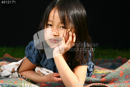 Image of Portrait of a young cute girl looking at the camera