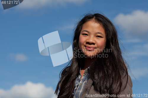 Image of Portrait of a young cute girl looking at the camera