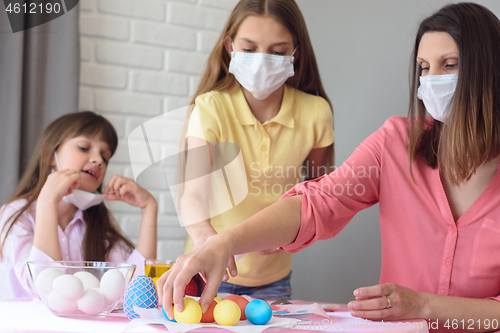 Image of Ill family paints eggs for Easter
