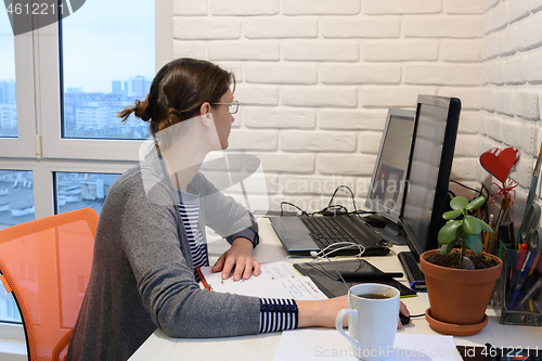 Image of Female student studying remotely at home online