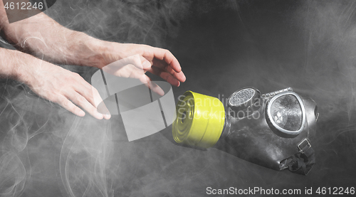 Image of Man in room filled with smoke, trying to reach for vintage gasma