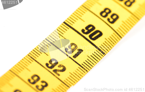 Image of Close-up of a yellow measuring tape isolated on white - 91