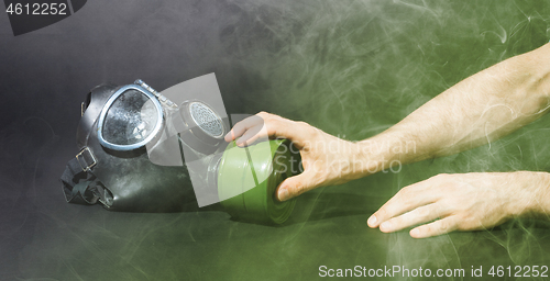 Image of Man in room filled with smoke, trying to reach for vintage gasma