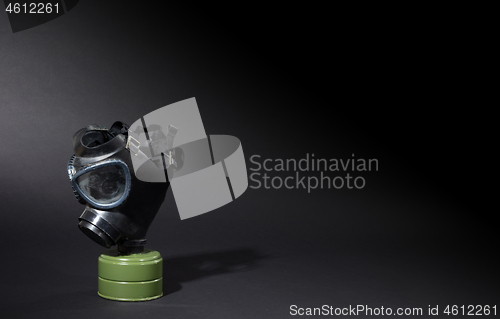 Image of Vintage gasmask isolated on black - Green filter