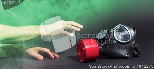 Image of Man in room filled with smoke, trying to reach for vintage gasma