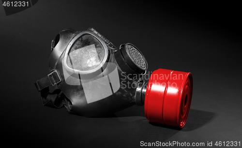 Image of Vintage gasmask isolated on black - Red filter