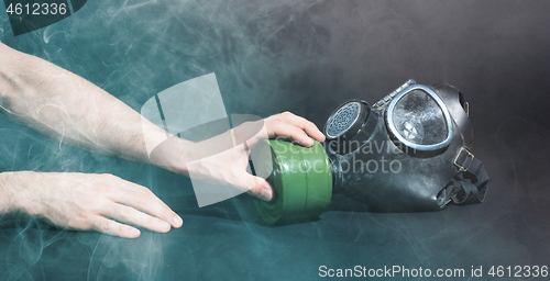 Image of Man in room filled with smoke, trying to reach for vintage gasma