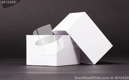 Image of Opened blank White box on black background