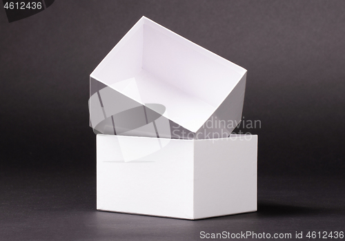 Image of Opened blank White box on black background