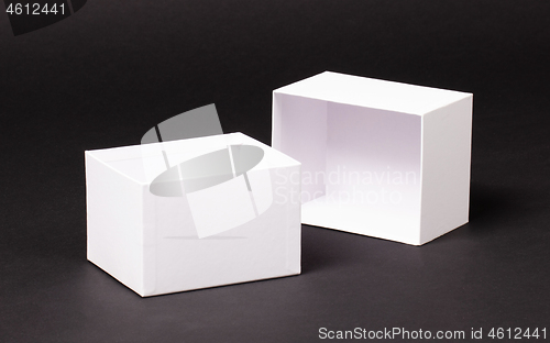 Image of Opened blank White box on black background