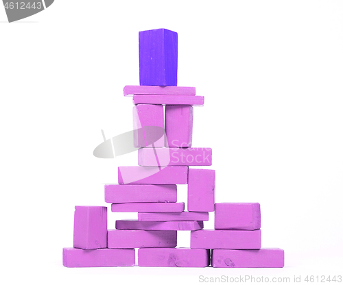 Image of Vintage purple building blocks isolated on white, one standing o