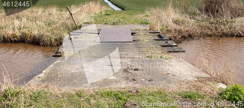 Image of Old concrete and wooden crumbling bridge 