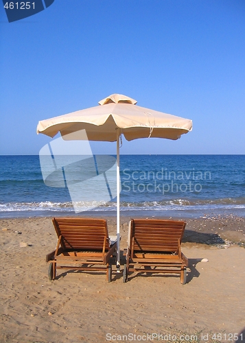 Image of Beach chairs and umbrella