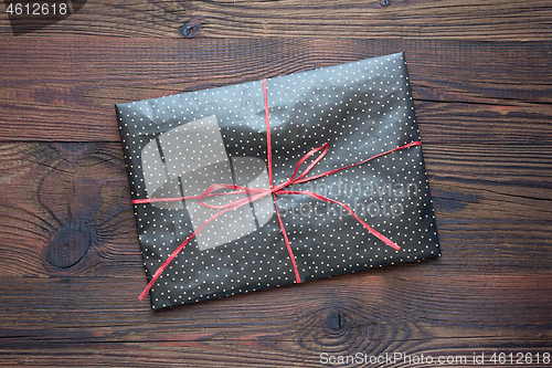 Image of wrapped gift on a wooden table