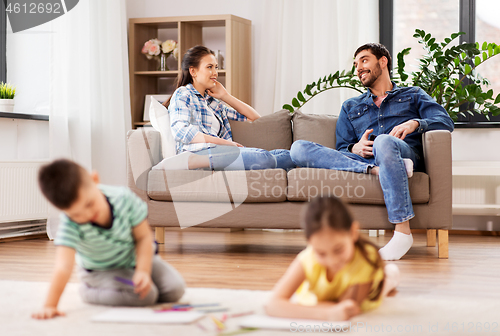 Image of happy family spending free time at home