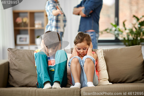 Image of sad children and parents quarreling at home