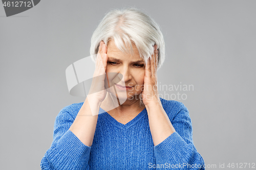 Image of senior woman suffering from headache