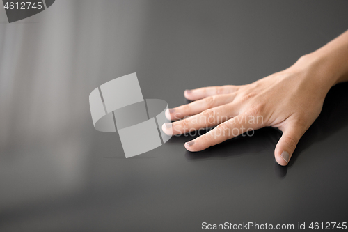 Image of hand using black interactive panel