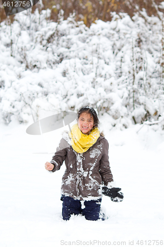 Image of Girl playing in the snow in winter in denmark