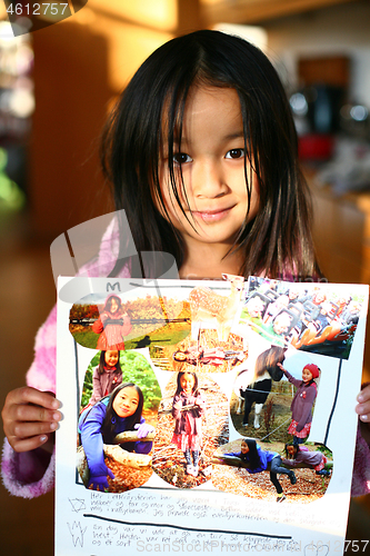 Image of Portrait of a young cute girl looking at the camera