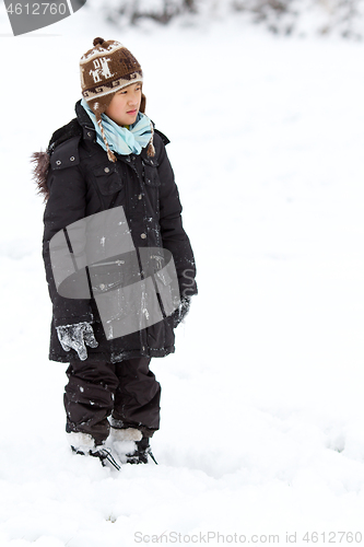 Image of Girl playing in the snow in winter in denmark