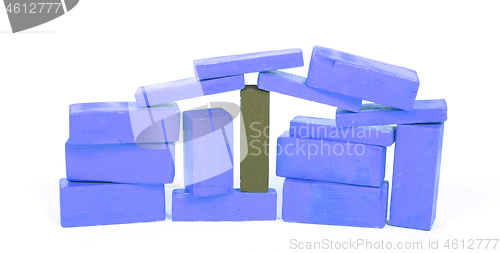 Image of Vintage blue building blocks isolated on white, one standing out