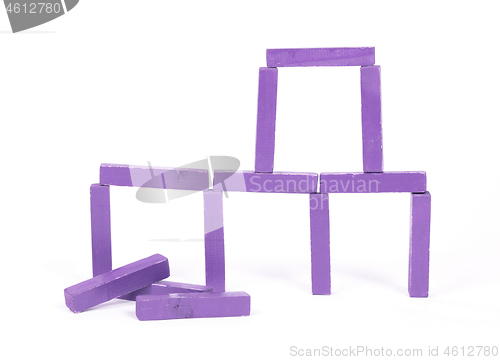 Image of Vintage purple building blocks isolated on white