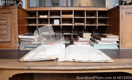 Image of Very old desk, full of old books and old paper