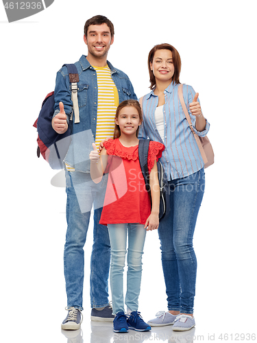 Image of happy family with travel bags showing thumbs up