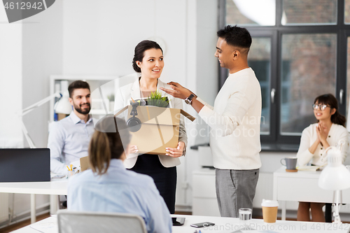 Image of new female employee meeting colleagues at office