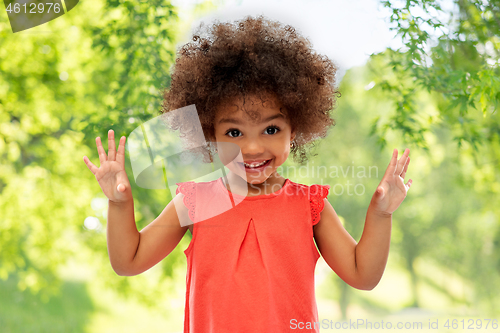 Image of happy little african american girl in summer