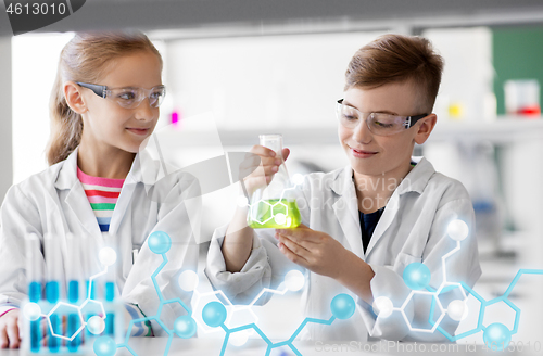 Image of kids with test tubes studying chemistry at school