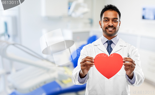 Image of male dentist with red heart at dental clinic