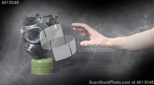 Image of Man in room filled with smoke, trying to reach for vintage gasma