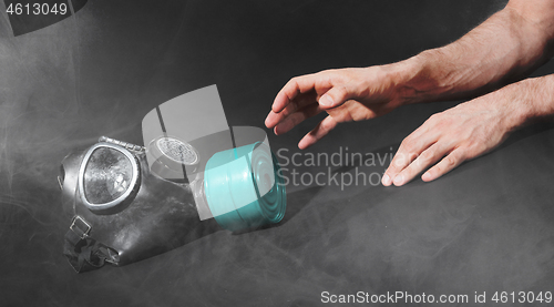 Image of Man in room filled with smoke, trying to reach for vintage gasma