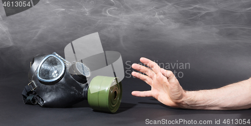 Image of Man in room filled with smoke, trying to reach for vintage gasma