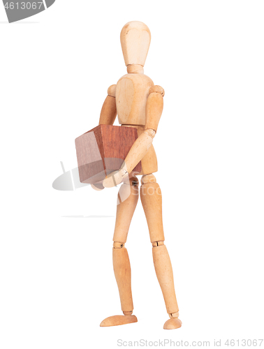 Image of Wooden mannequin carrying a wooden hardwood block