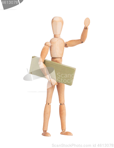 Image of Wooden mannequin carrying a wooden block