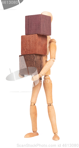 Image of Wooden mannequin carrying wooden hardwood blocks