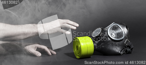 Image of Man in room filled with smoke, trying to reach for vintage gasma