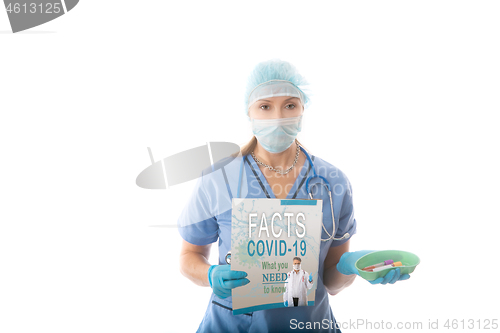 Image of COVID-19 - Nurse hospital pathologist holds a brochure and blood