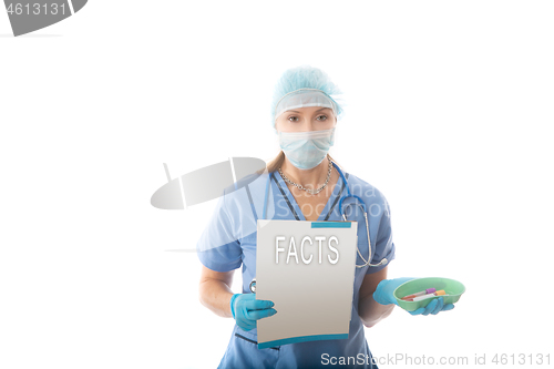 Image of COVID-19 - Nurse hospital pathologist holds a brochure and blood