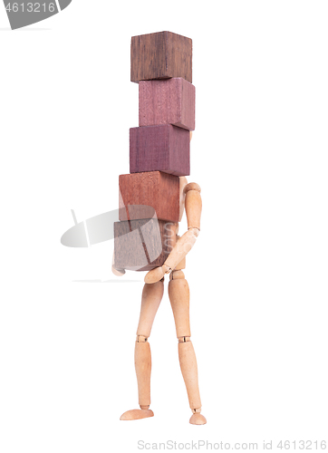 Image of Wooden mannequin carrying wooden hardwood blocks