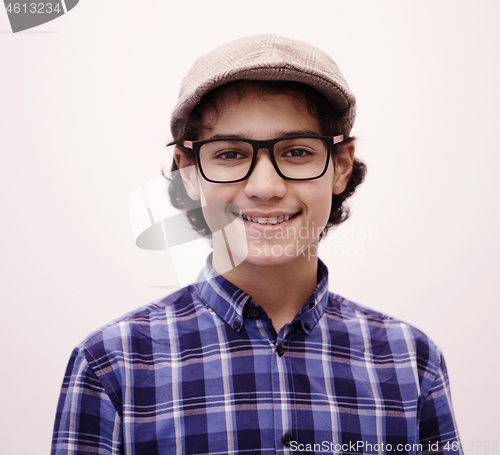 Image of portrait  of smart looking arab teenager with glasses