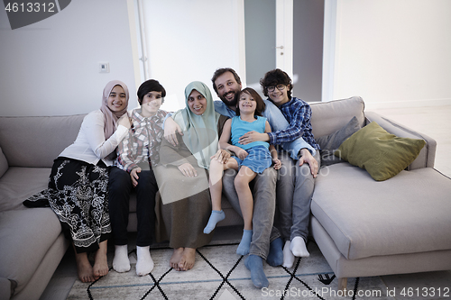 Image of muslim family portrait  at home