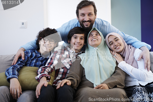 Image of muslim family portrait  at home