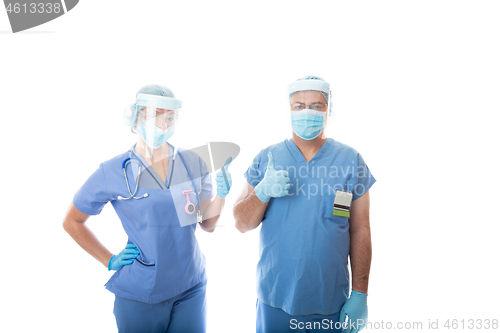 Image of Two critical care nurses give a thumbs up gesture